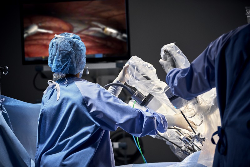 Operating staff looking at surgical monitor